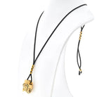 Cartier 18K Yellow Gold Panthere On A Black Cord Necklace - The Back Vault