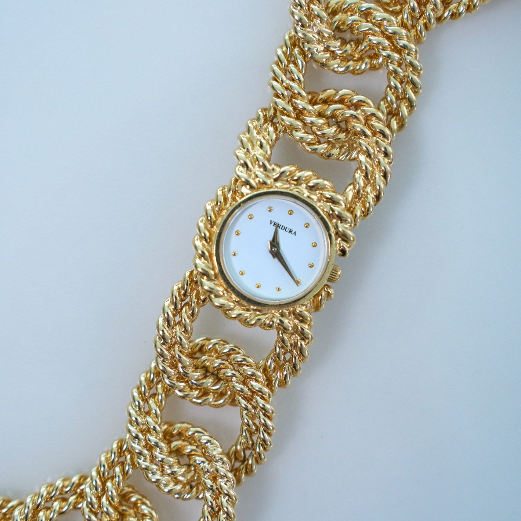 Verdura braided watch on a light gray background